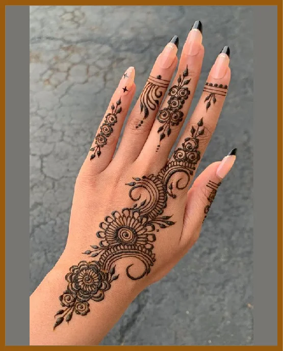 Aesthetic Mehndi Design For Back Hand With Curled Vines And Floral Touches